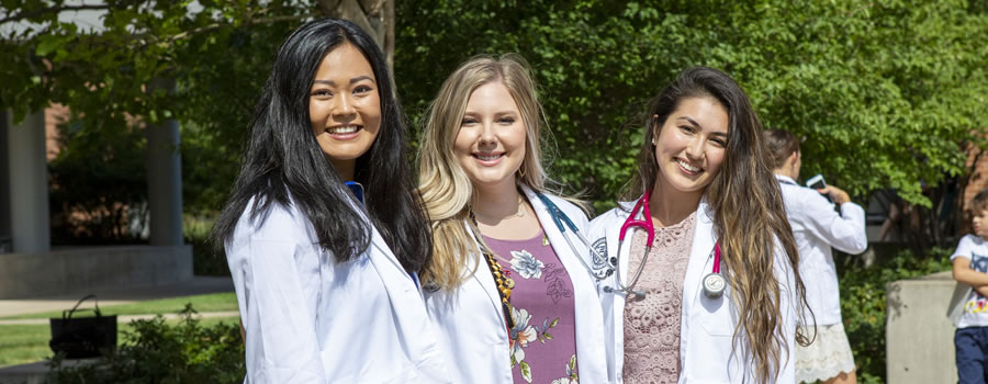 Three PA students on the Anschutz Medical Campus